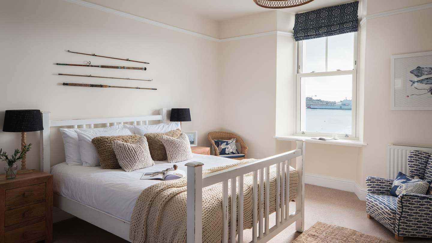 A comfortable accent chair provides the perfect setting for relaxing morning coffees, spent gazing across the calming waters