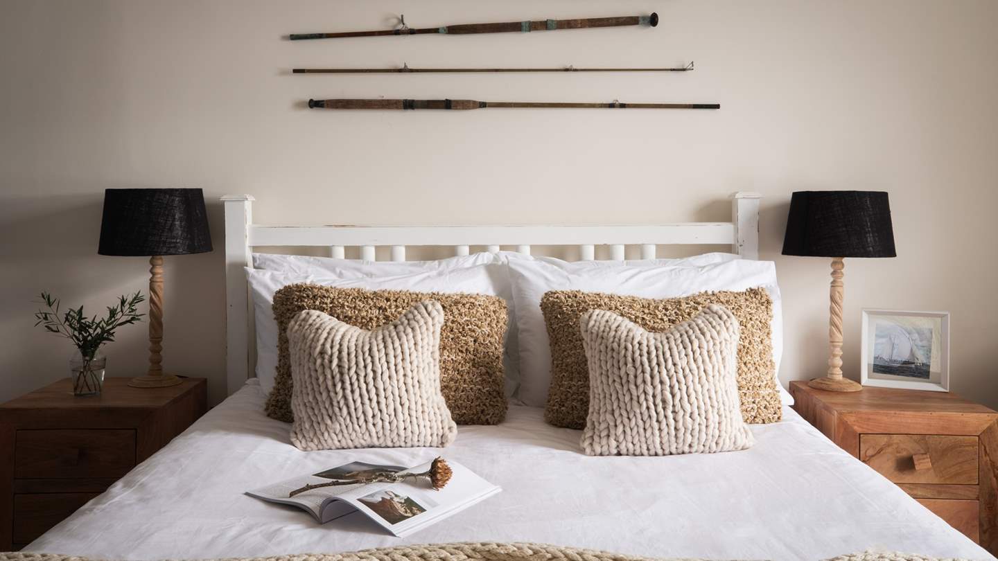 Bedroom three can also be found on the first floor, with marine-themed finishing touches and fleecy knitted throws and cushions