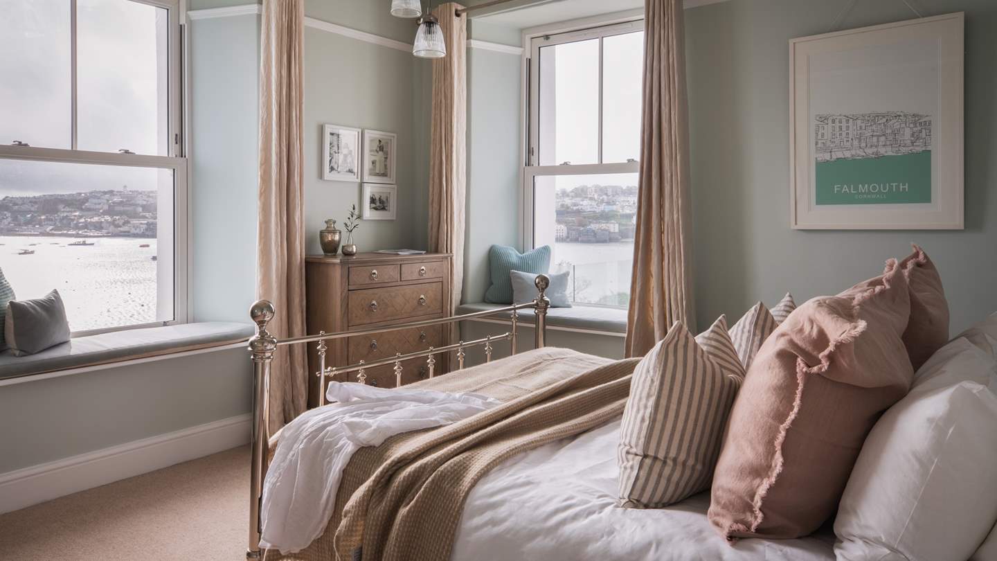 Dual aspect window seats offer magnificent views across the water