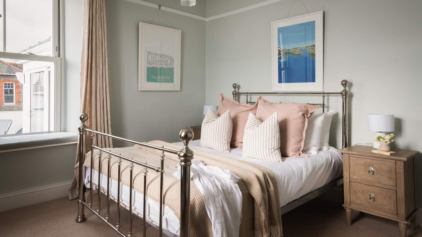 The second bedroom resides on the first floor too, with a darling king-sized bed