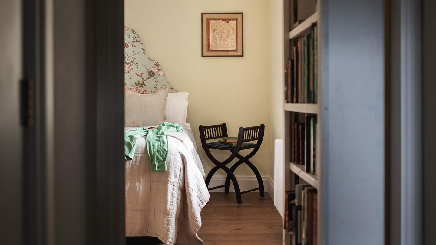 Discover Eden Hall’s fourth bedroom and immerse in tranquillity, enjoying the soothing tones and verdant views over the garden