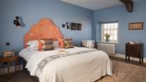 Bathed in blue, Eden Hall’s first bedroom resides on the first floor and exudes restful vibes