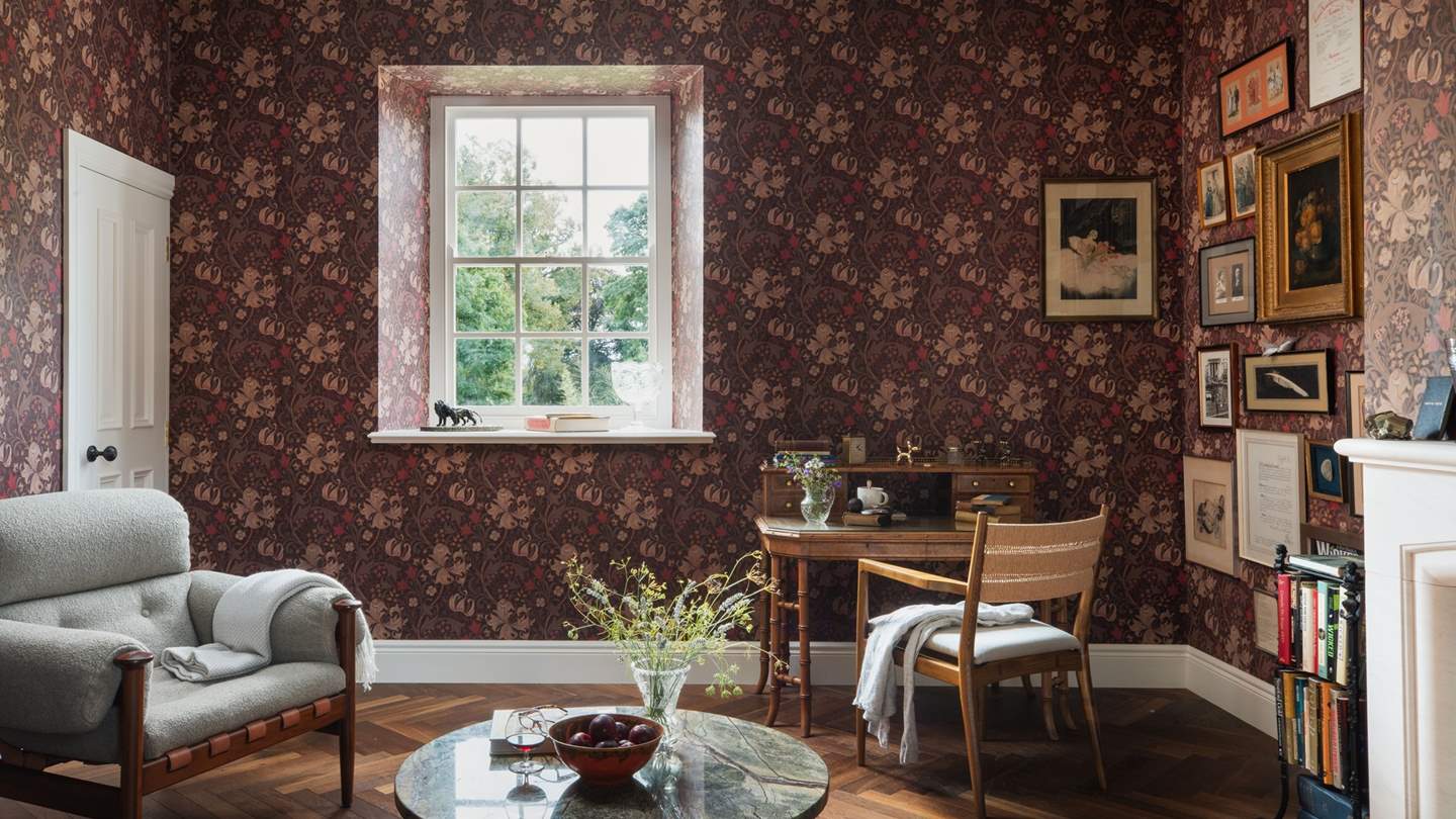 An antique writing desk beckons for pen to paper creation