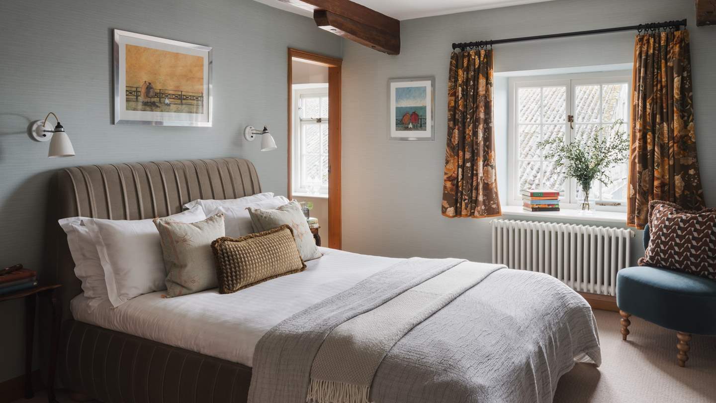 The sixth bedroom presents a peaceful idyll, decorated in a calming, neutral palette