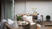 The wooden patio deck is a splendid setting to reside on balmy days