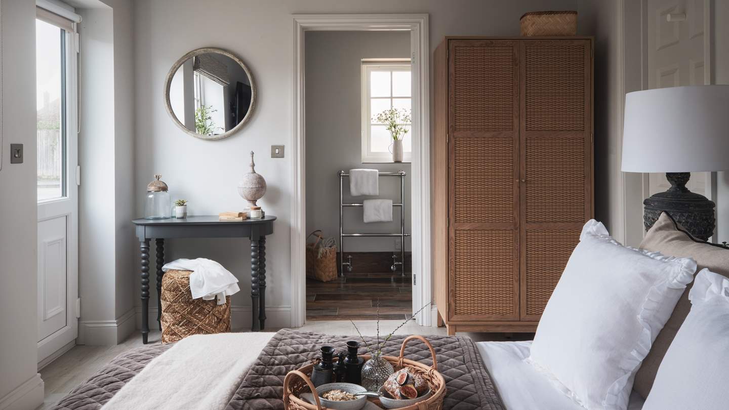 Charming with pale hues and cosy finishes, this room is just a dream