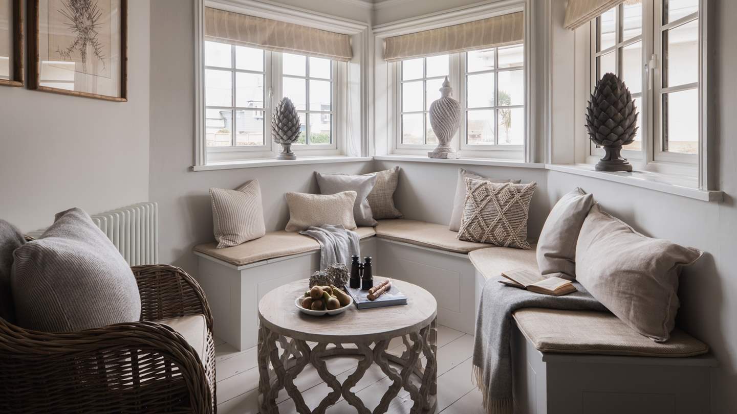 A cosy corner seating area is perfect for looking out to the blissful garden space 