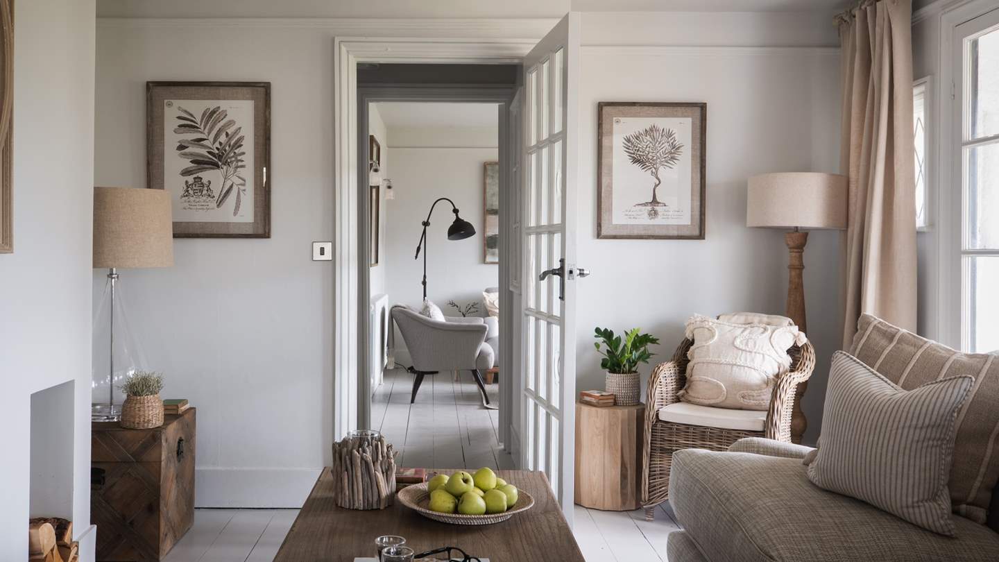 Complete with a sumptuous sofa and cosy armchairs resting beside tables, there’s plenty of space to unwind