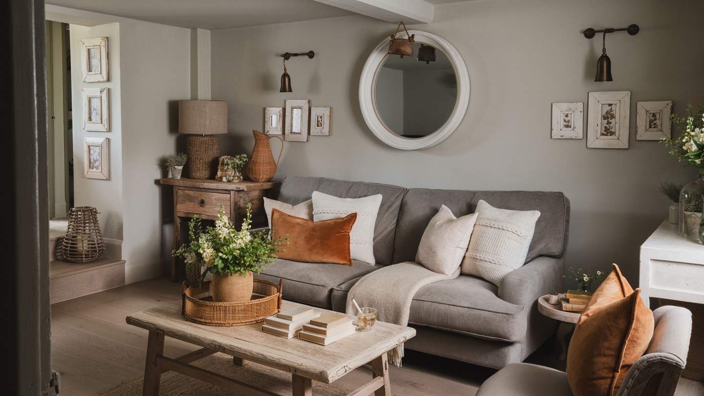 A sumptuous sofa and two occasional chairs offer plenty of space to relax and unwind