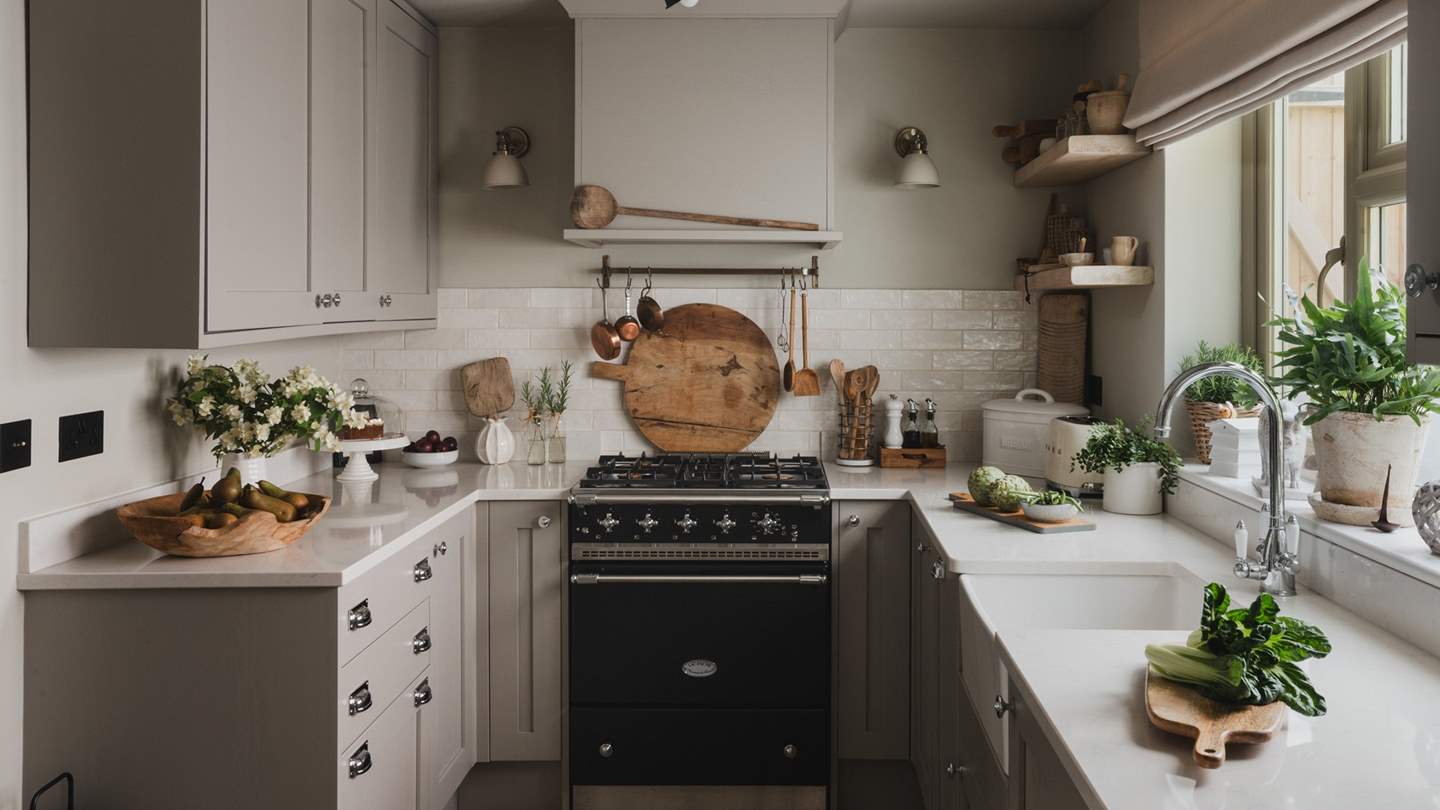 A charmingly modern kitchen can be found at the back of the retreat