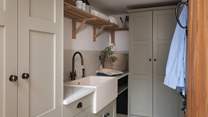 The utility offers a handy space to store and reset the essentials...