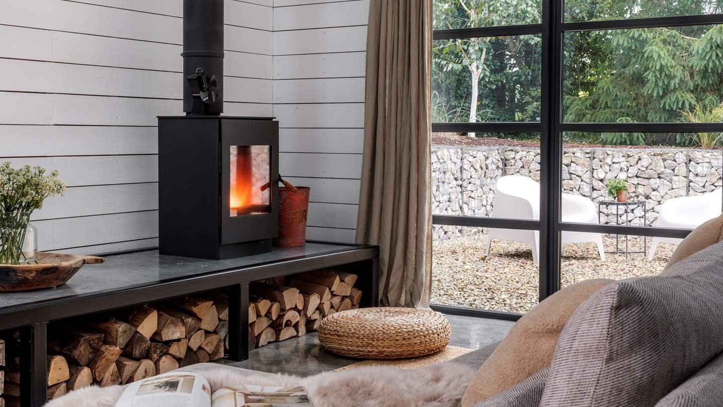Moments of relaxation reside by the crackling Burley wood burner