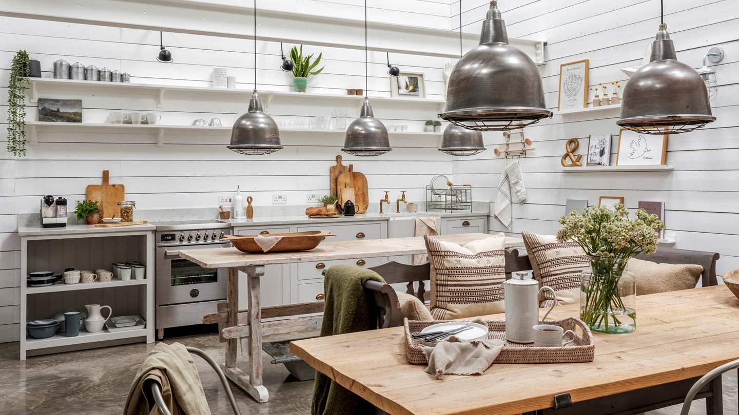 Merging with the living area, the Scandi-inspired kitchen and dining area set an atmospheric scene for brunches and suppers at home