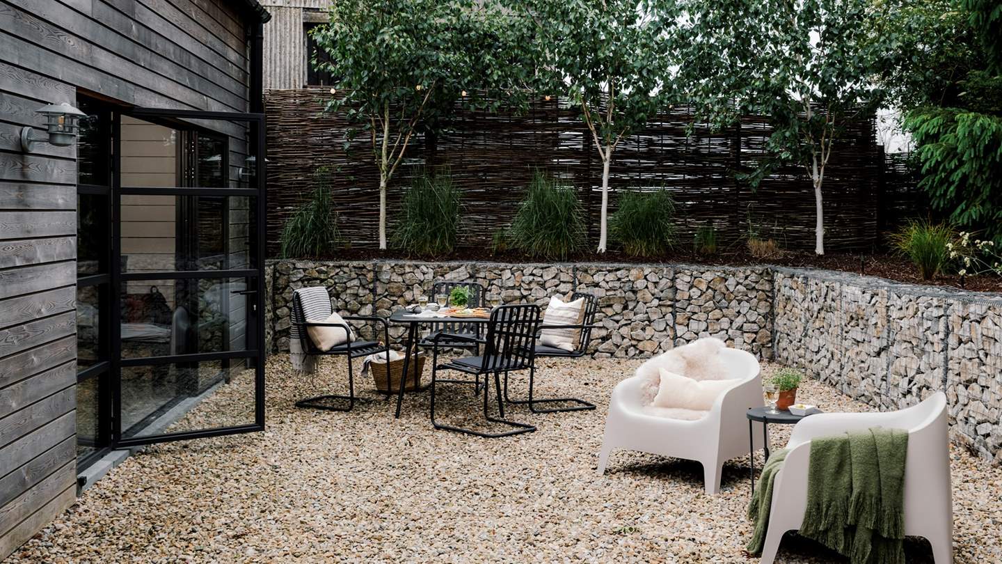 Just lovely for those slow-paced mornings and balmy evenings kissed by a low sun, the garden features a dining table and bench, two loungers and a firepit BBQ