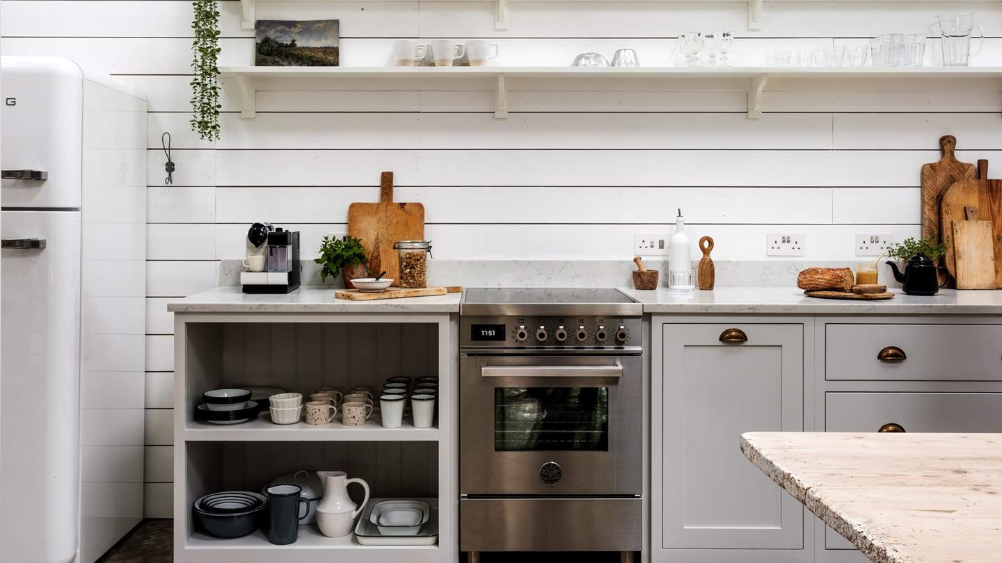 Tastefully presented, everything you could need is provided for culinary prep, including a dishwasher, Bertazzoni cooker with induction hob, Smeg fridge and freezer and more