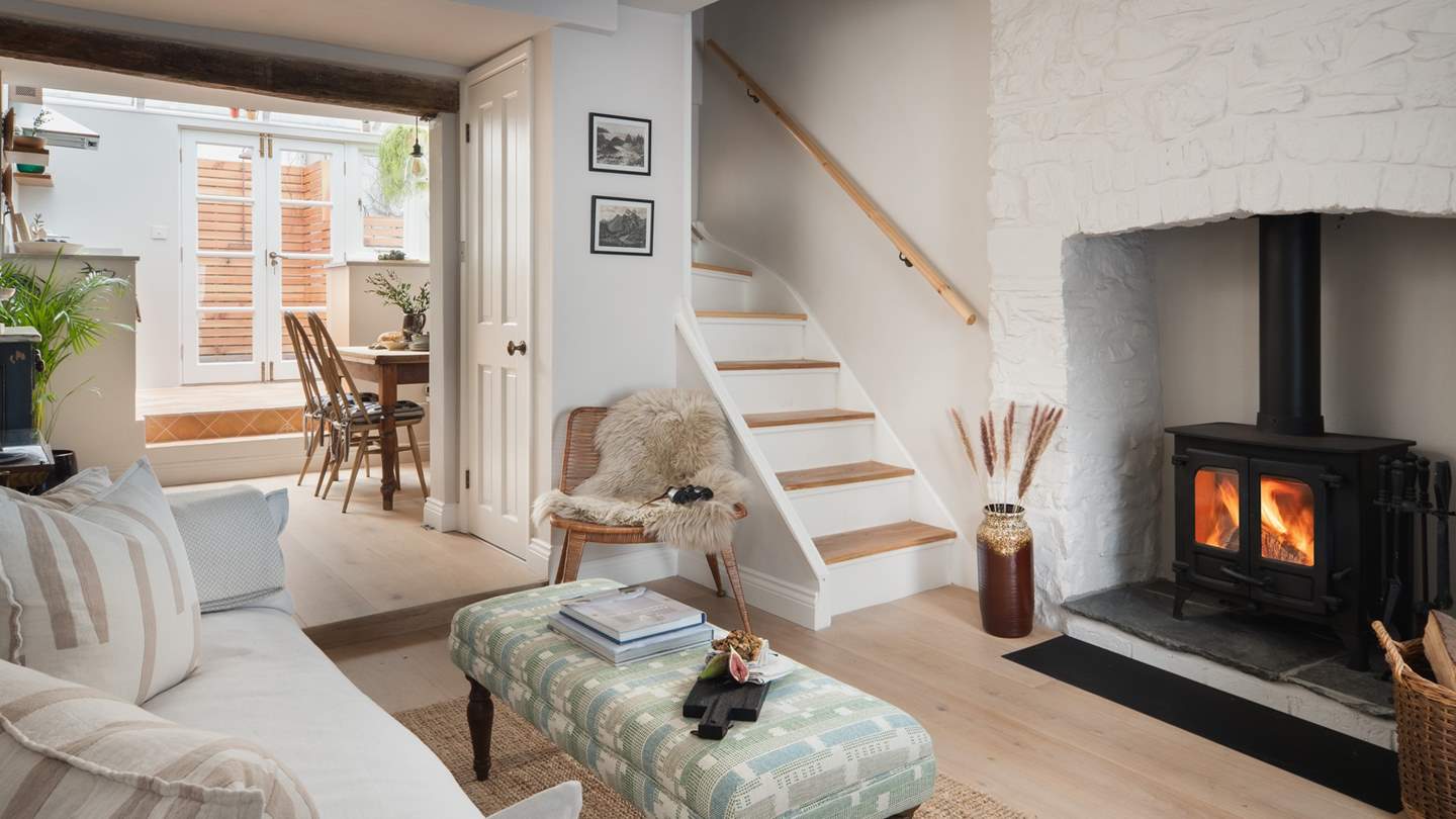 At the heart of the living room lies the exposed, white stone inglenook fireplace with a wood burning stove, where dreamlike moments are promised cosied up fireside...