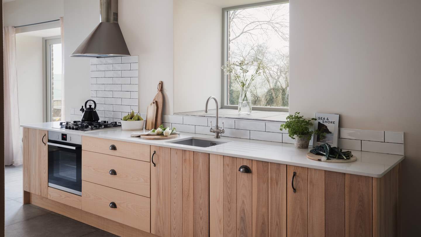 The contemporary kitchen with rustic touches is a dream to cook in