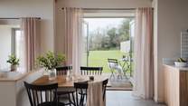 French doors open onto a delightful patio, perfect for alfresco feasting 