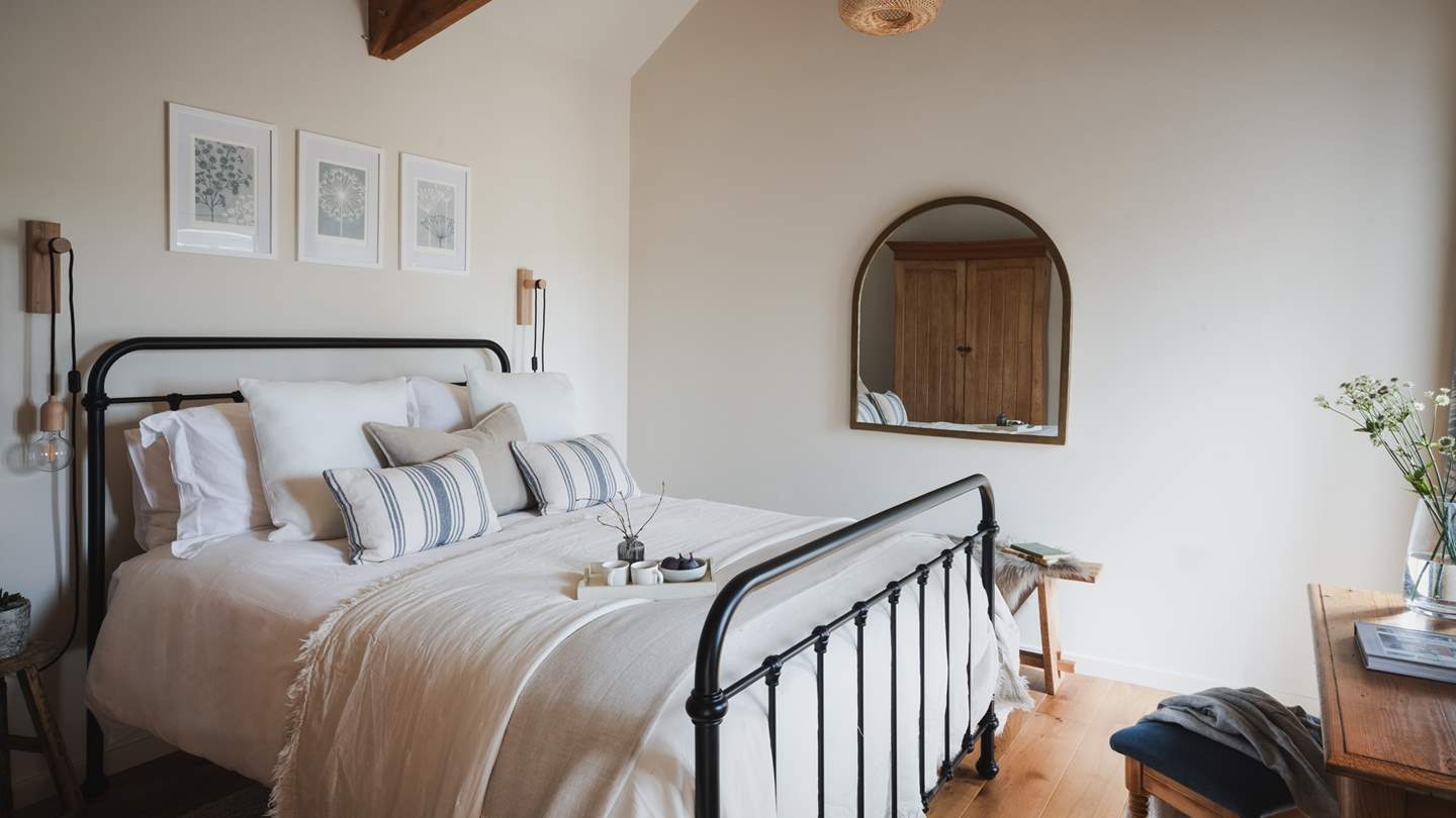 A king-size Feather and Black bed with a sumptuous Sealy mattress promise deep sleeps and unhurried mornings