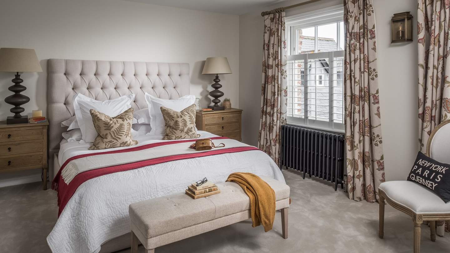 A picture of perfection, the second bedroom stars a super king-sized bed draped in fine linens which beckons for slow mornings and cosy eves