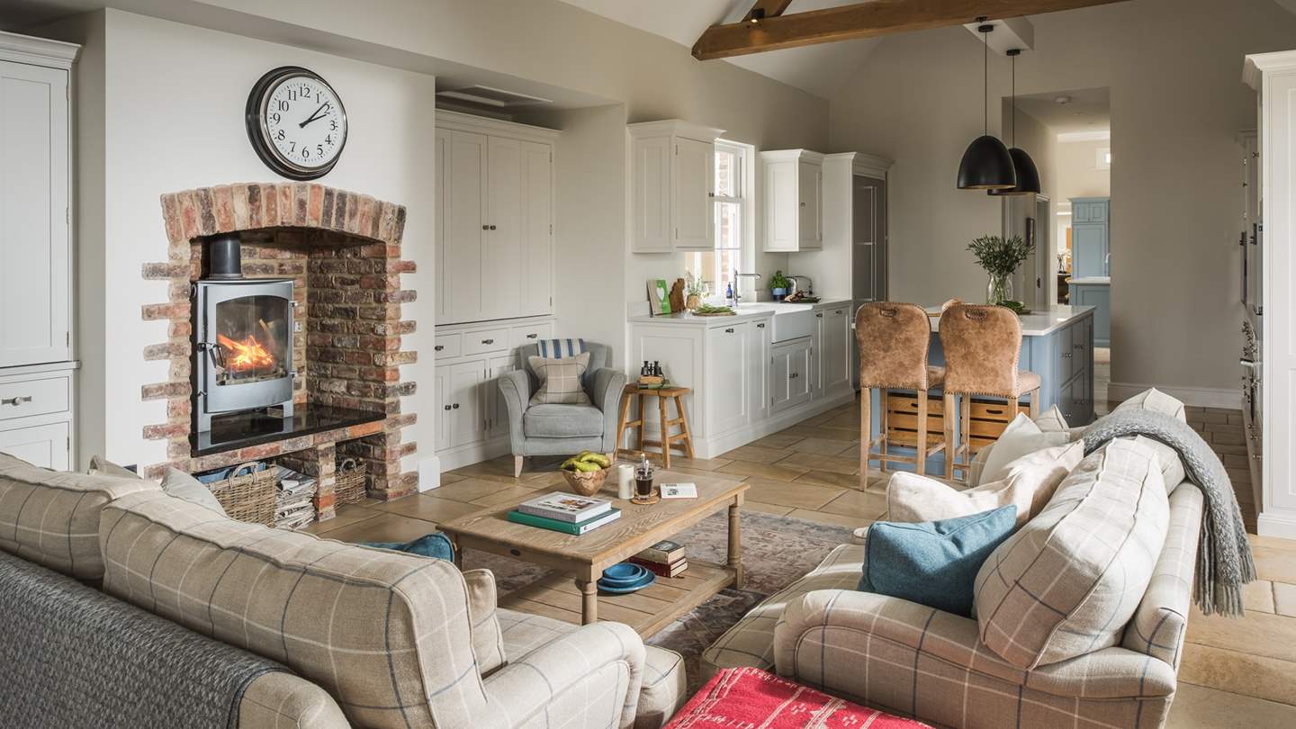 Spend spellbinding hours on one of the comfortable sofas angled around a wood burning stove