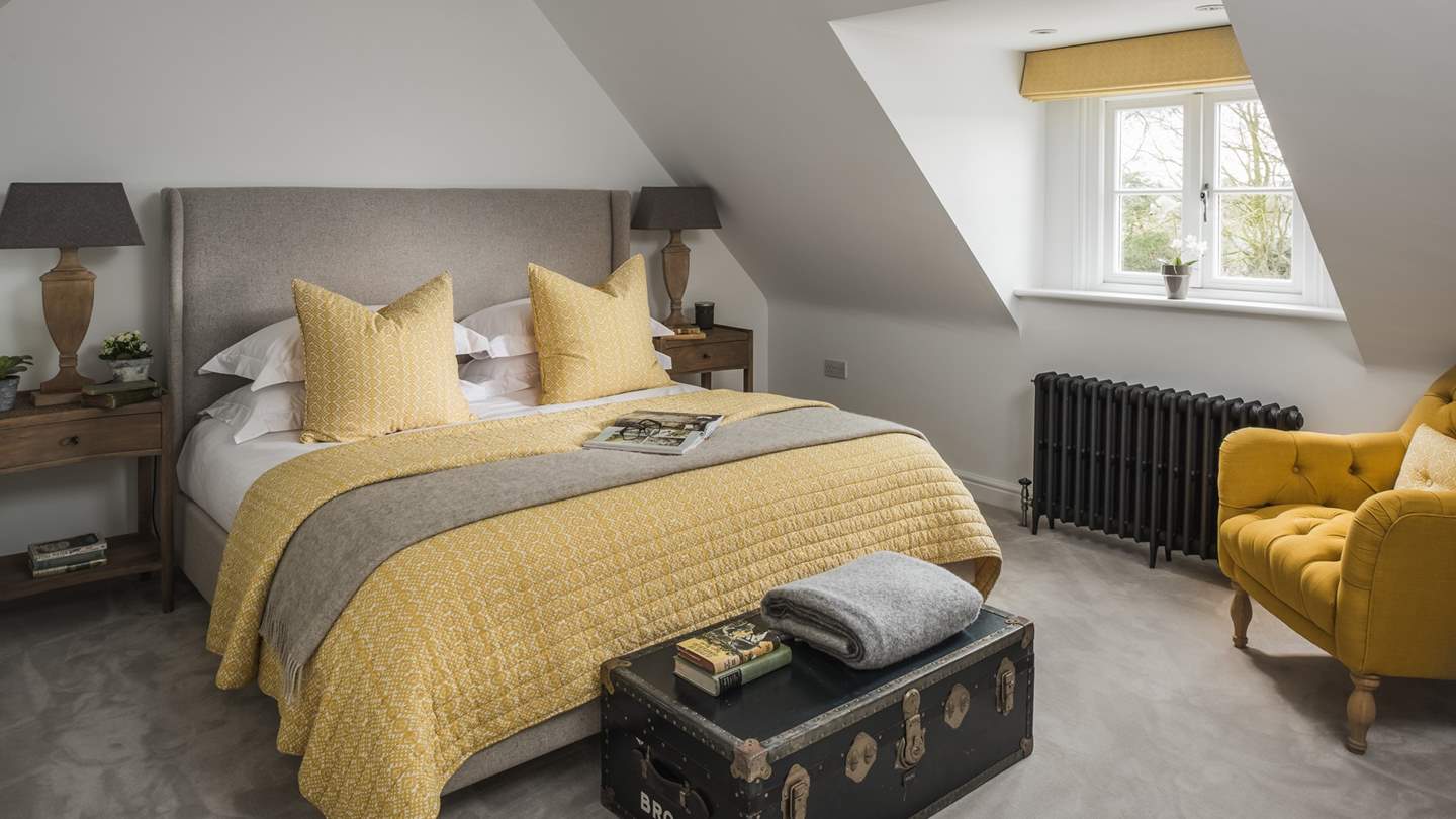 Found on the second floor, bedroom four presents a super king-sized bed and an armchair for leisurely breakfast-in-bed moments