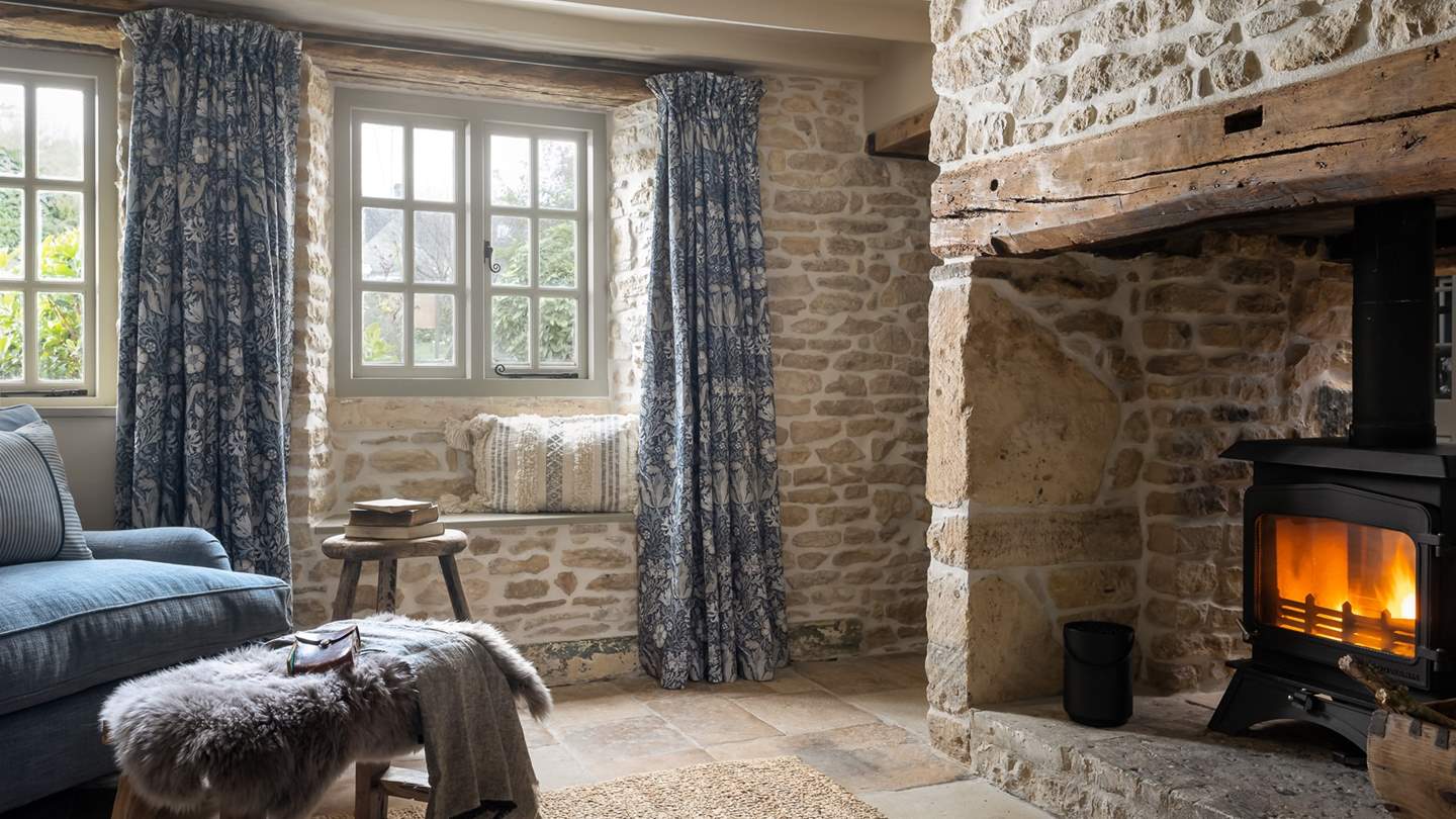 At the heart of the room, a handsome wood burning stove promises toasty feasting 