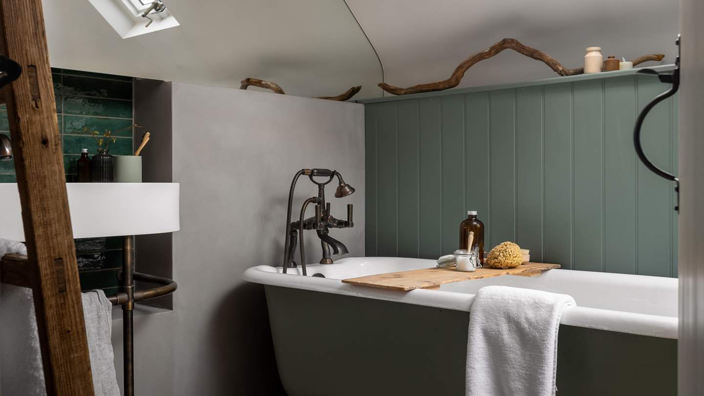 A family bathroom promises a rolltop bathtub for bubble-topped soaks...