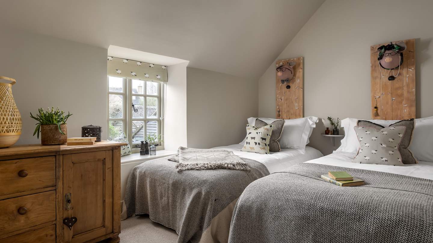 A cute farmyard theme exists in the twin bedroom, a perfect space for the little ones