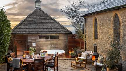 A charming wood burning stove and balmy cedar hot tub await in the garden of dreams...