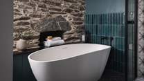 Slip into the deep bathtub for moments of bubble-topped tranquillity 