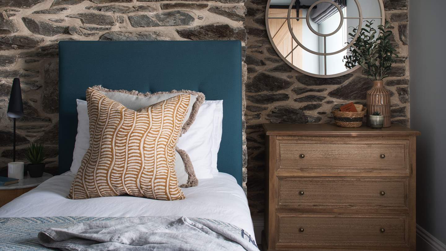 Completing the picture are two bedside tables with marble tops, a chest of drawers 