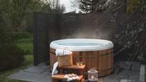 An irresistible outdoor hot tub awaits for those atmospheric dips under open skies