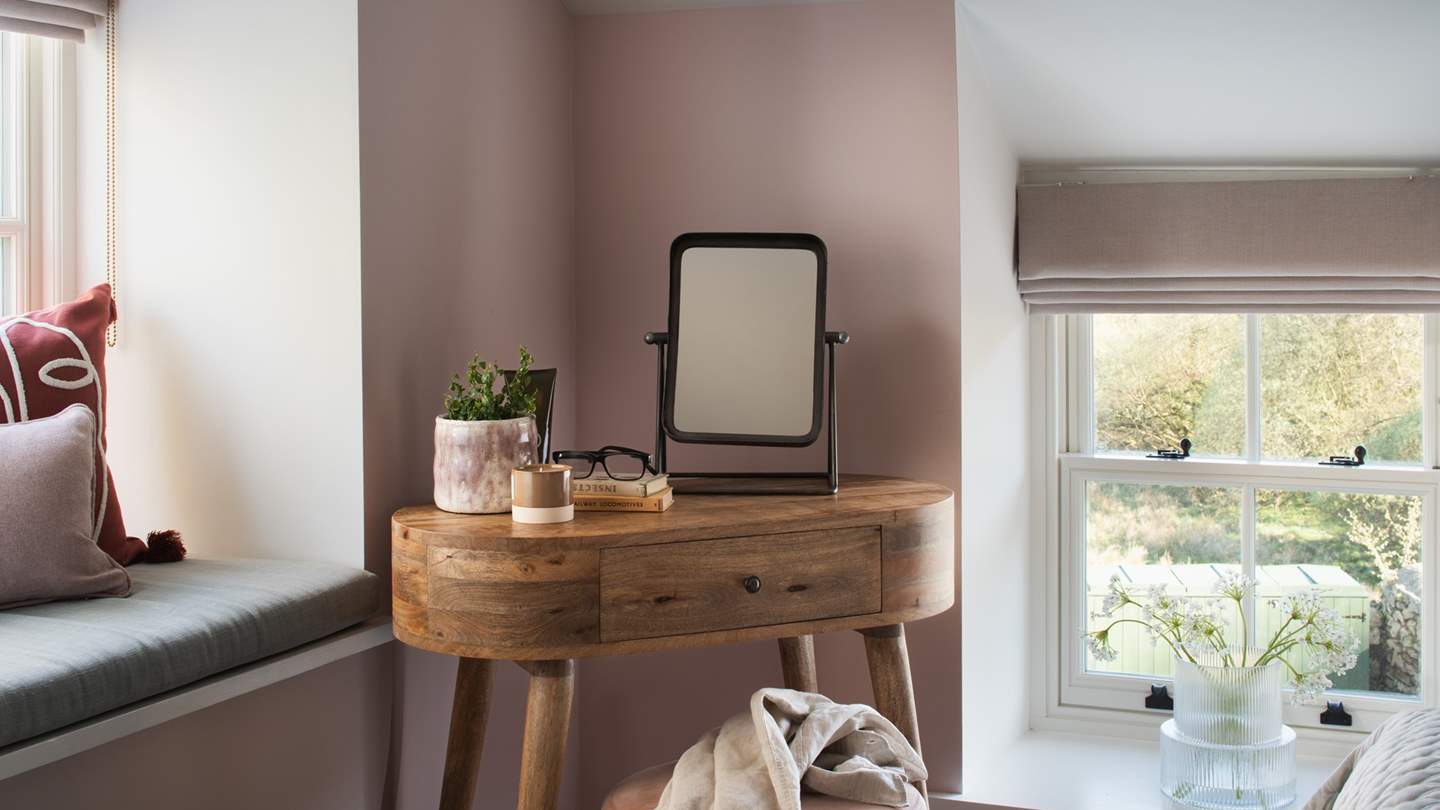 For added convenience, it also features a built-in wardrobe and shelves, a dressing table, and a stool