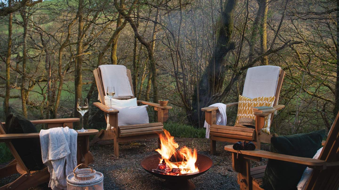 A delightful fire pit area has four cosy lounge chairs settled around the crackling fire pit - just idyllic for laidback evenings accompanied by a bottle of something special