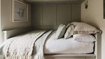 Also decorated in tranquil earthy tones, the second bedroom invites for peaceful moments of rest