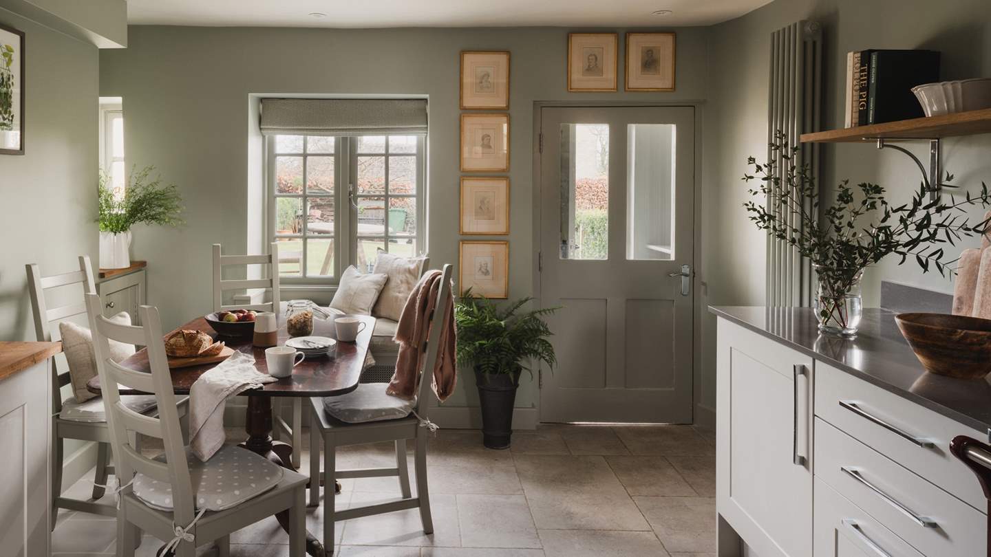 The kitchen and dining space blends rustic charm with modern touches 