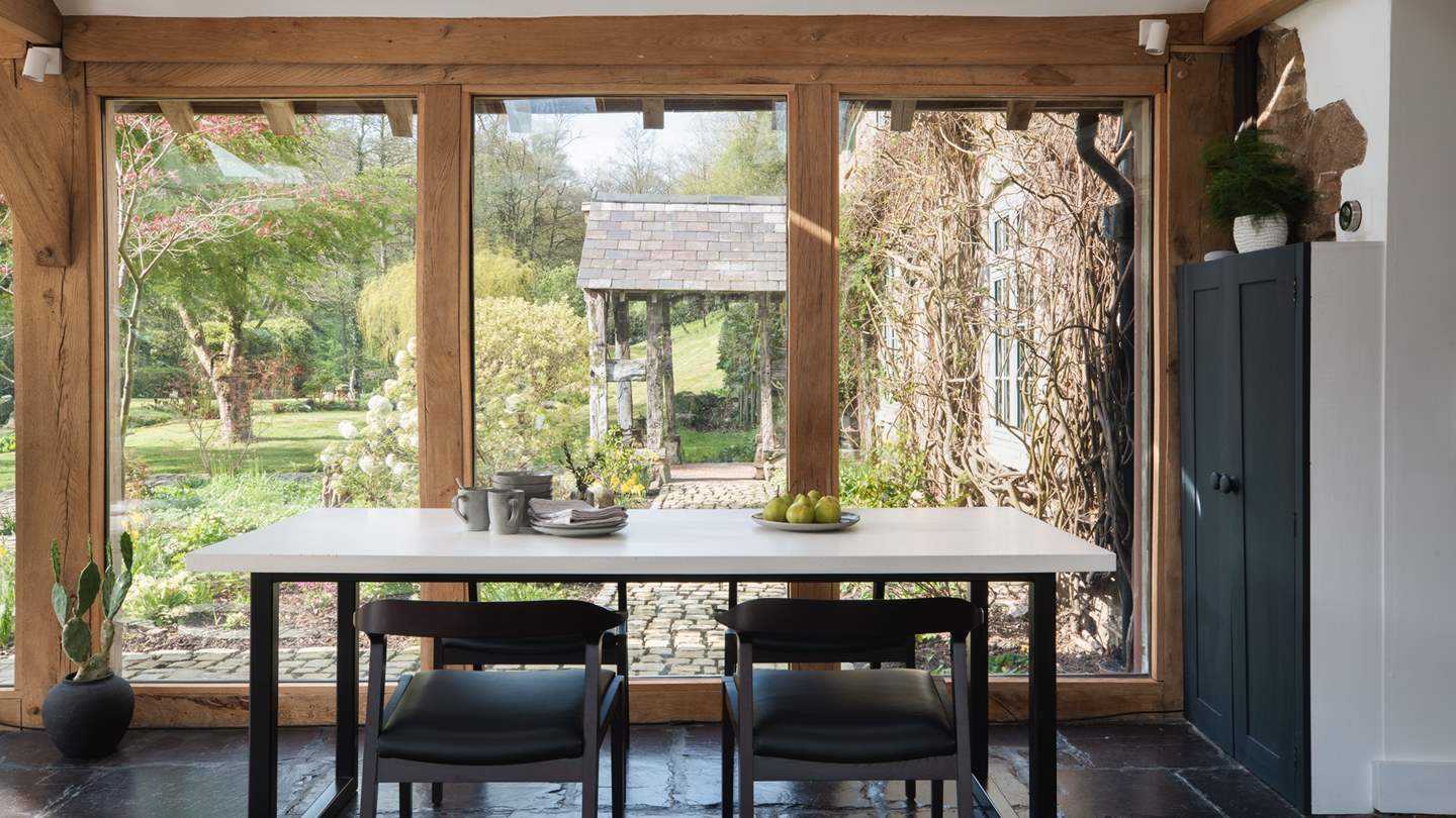 Delight in casual dining moments whilst admiring the blissful garden and trees beyond 