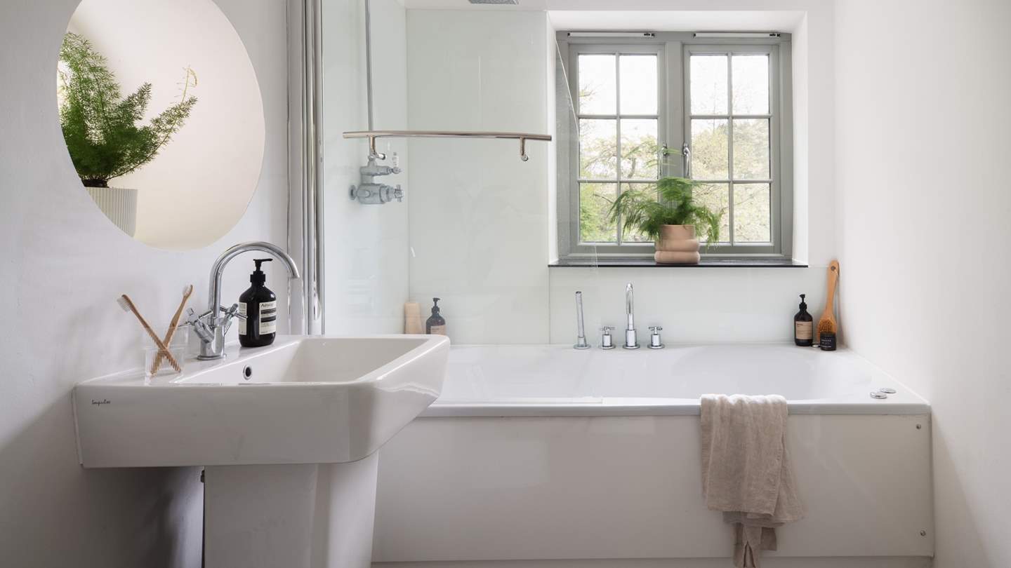 You'll find the brilliant white bathroom via a secret painting... 