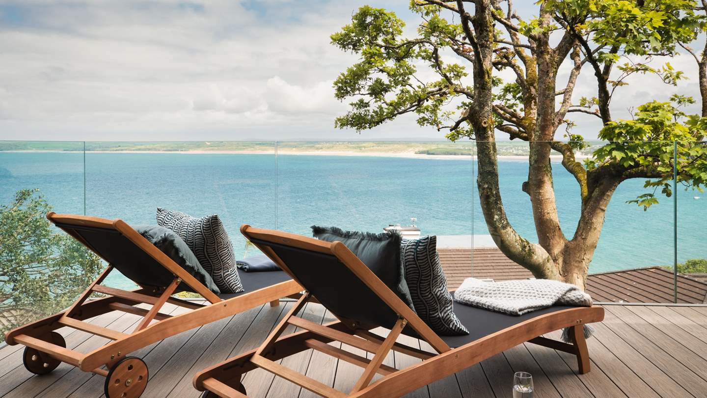 Two sun loungers set before the sixth bedroom promise the most magical sun-kissed summer moments