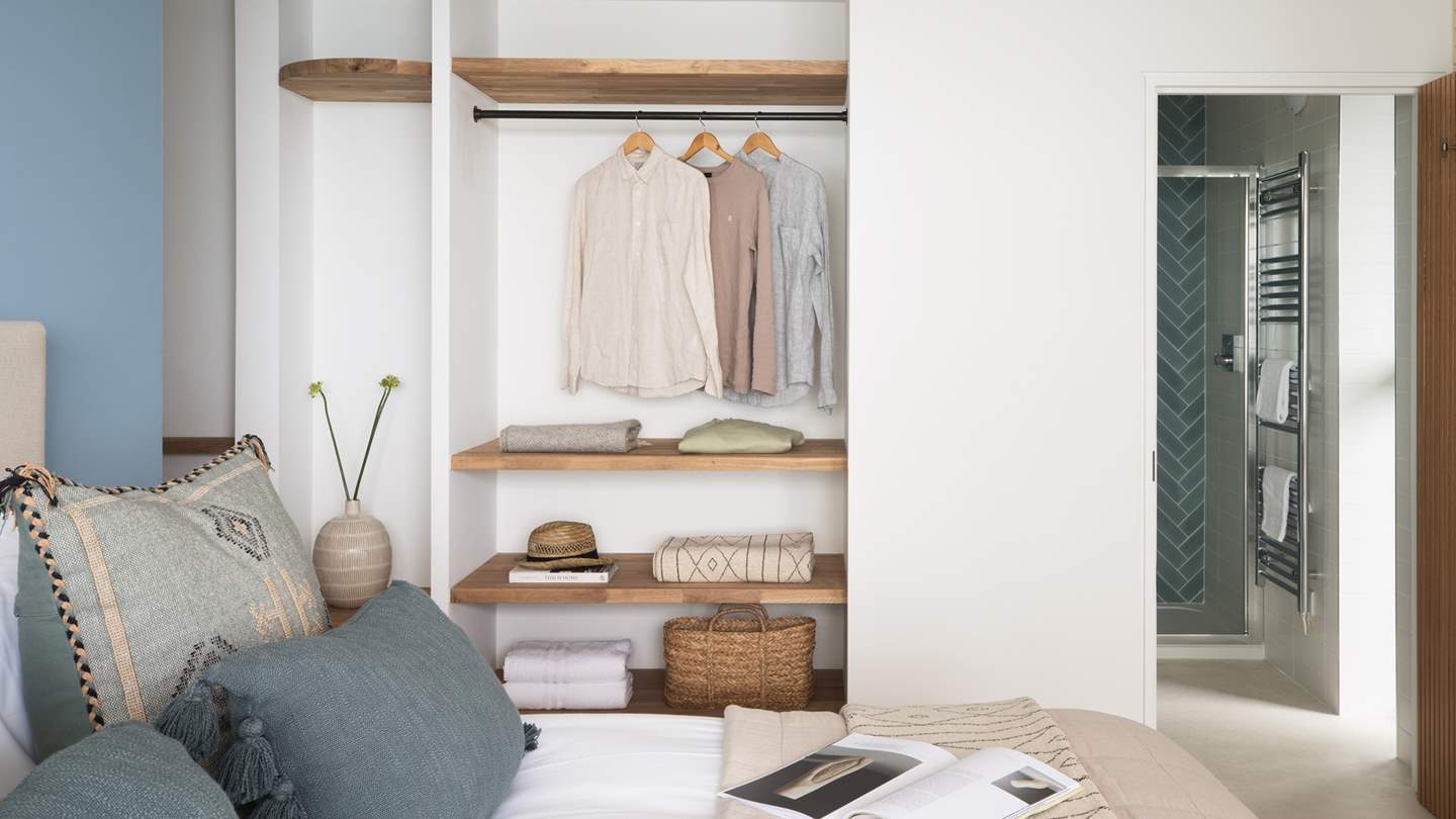 There’s a large wardrobe for storing your belongings, plus a dressing table and reading chair for moments of calm