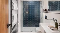 On the lower level, you will find an additional shower room, which is perfect for washing away sand post-beach days