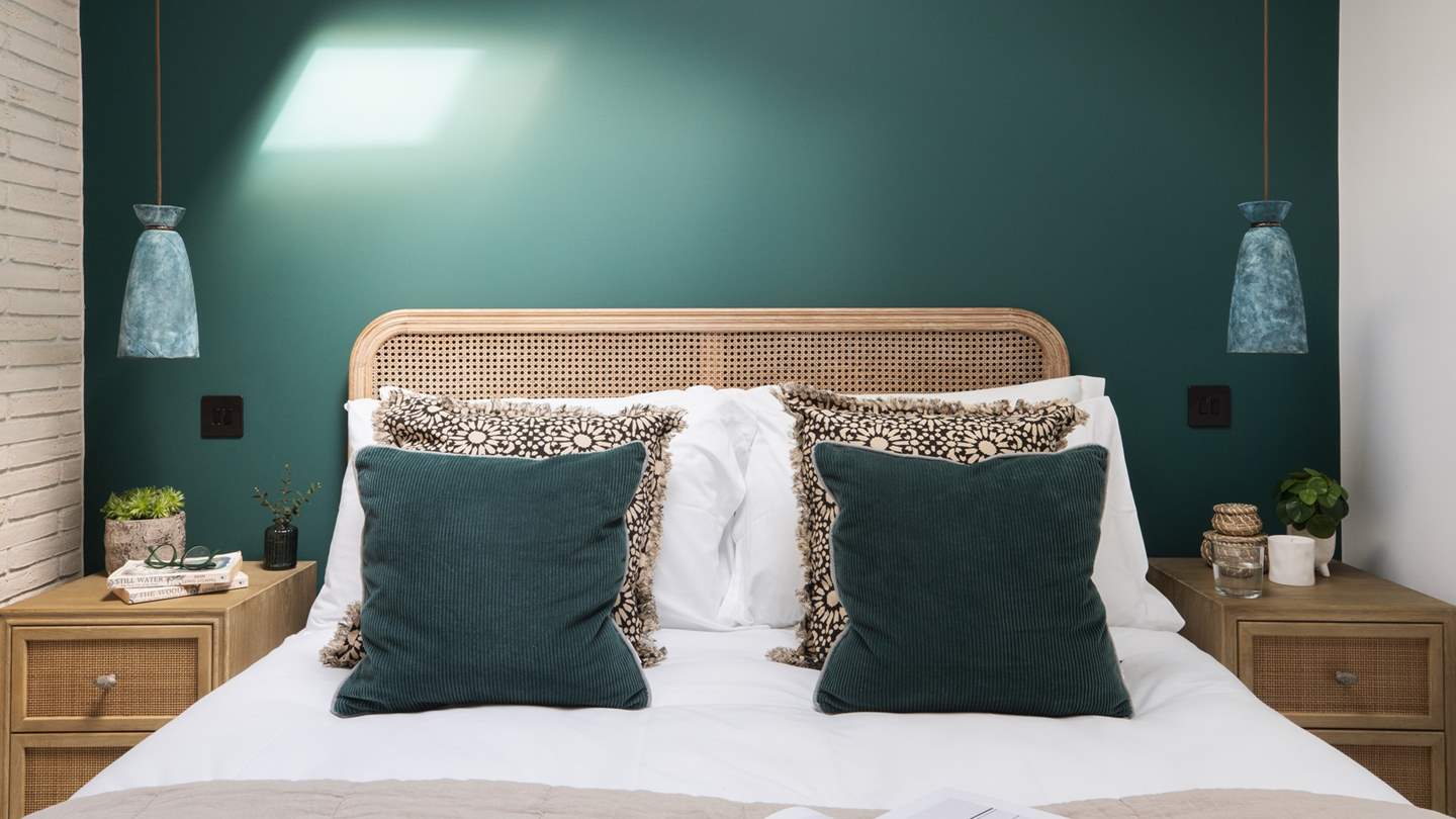 Bedroom three is positioned on the ground floor, with a king size bed dressed in luxurious linens and throws, plus a star-gazing skylight with remote controlled blackout blind 