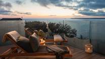Watch as sun sets over the Cornish coastline from the blissful balcony...