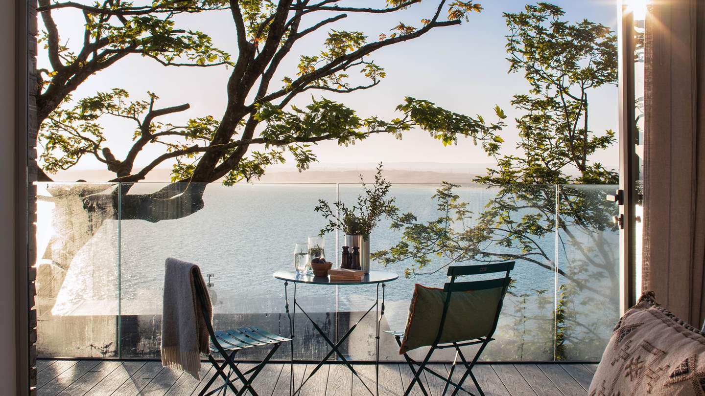 Step outdoors onto the beautiful balcony, with a darling bistro table to sit and admire the view at any time of the day