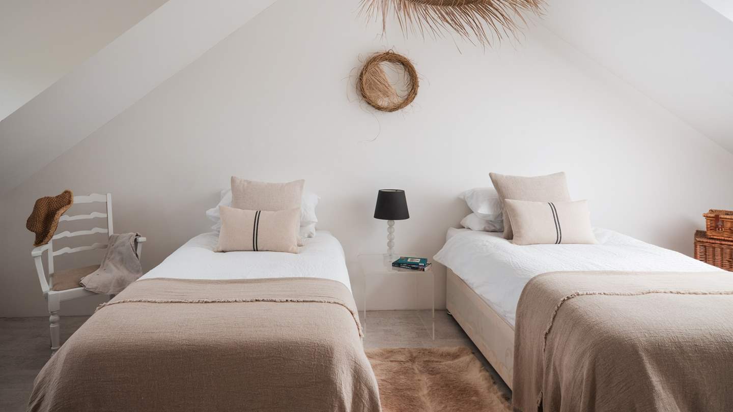 In the adorable final bedroom, you will find equally calming tones and twin zip and link beds