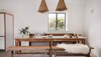 Folklore style feasting awaits around the understated solid pine dining table...
