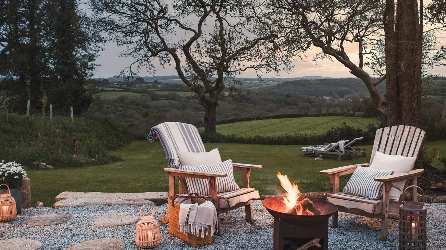 The Adirondack chairs invite for starlit conversation beside the firepit