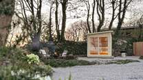 An electric sauna resides for moments of wellness in the wild...