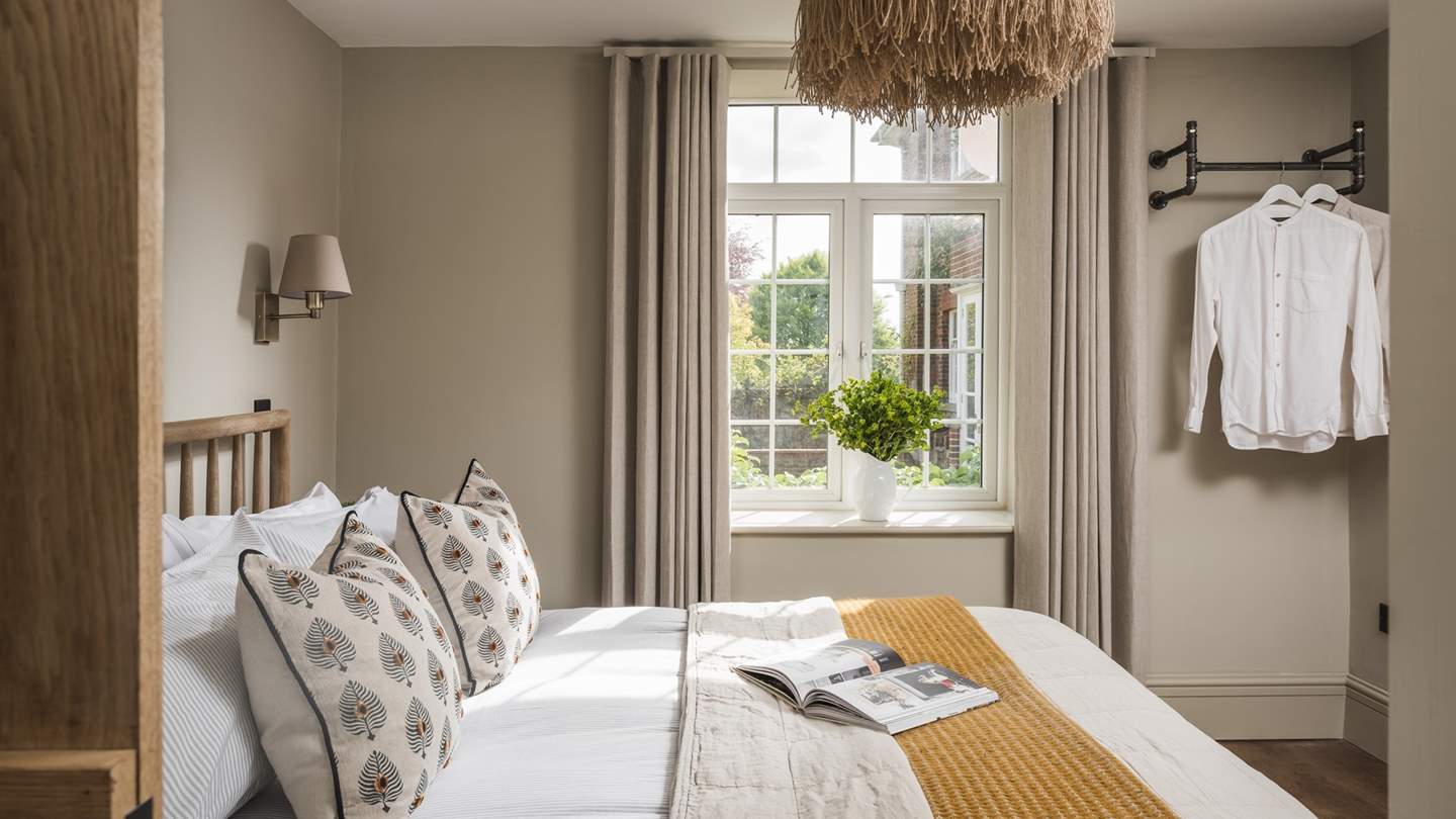 The second bedroom decorated in neutral tones radiates calm